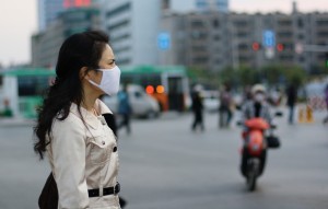 Woman wearing a face mask, China