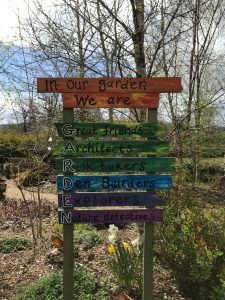 A signpost about a garden at a children's hospice