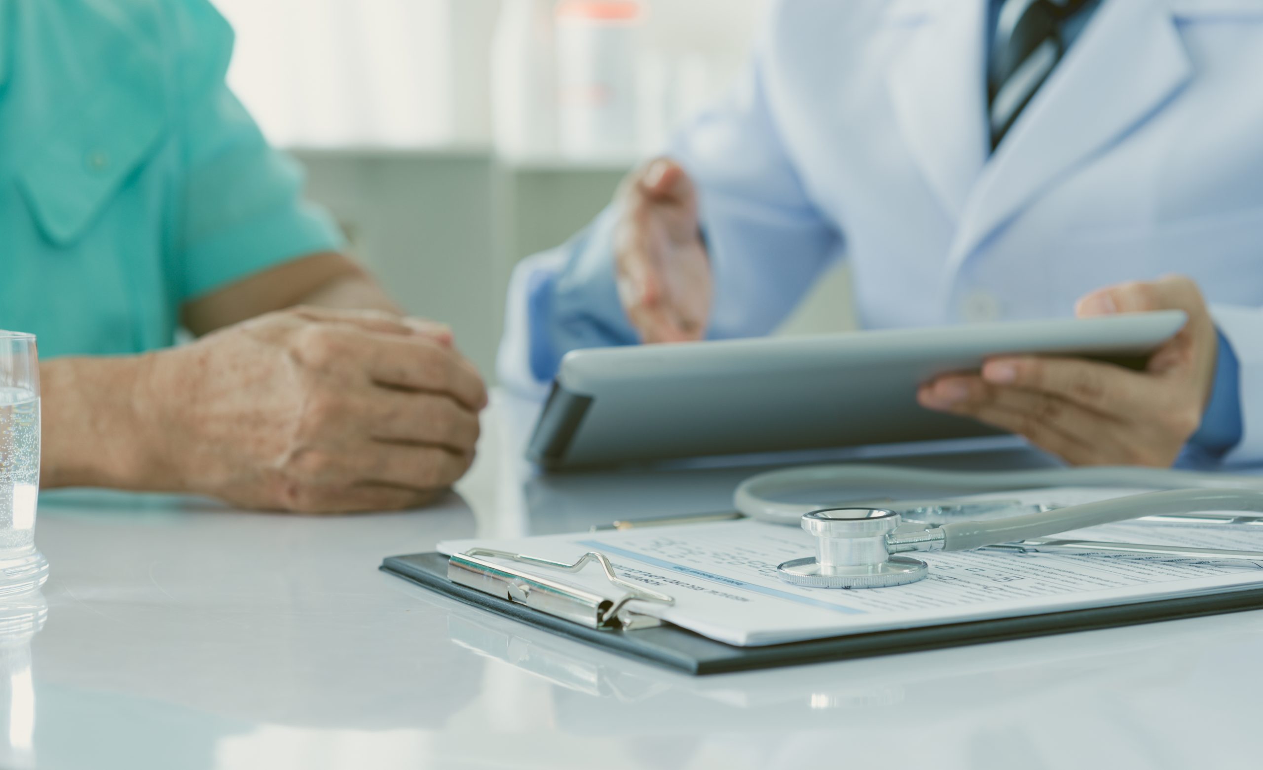 This photograph of a doctor and patient represents a discussion over NHS patient data