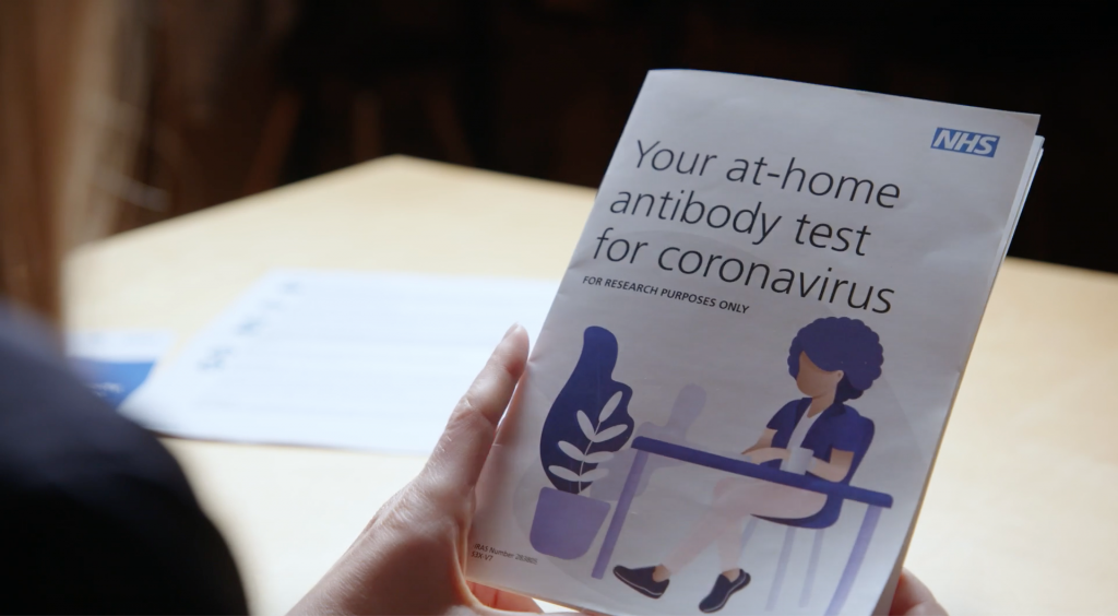 A person reading an antibody test instruction manual