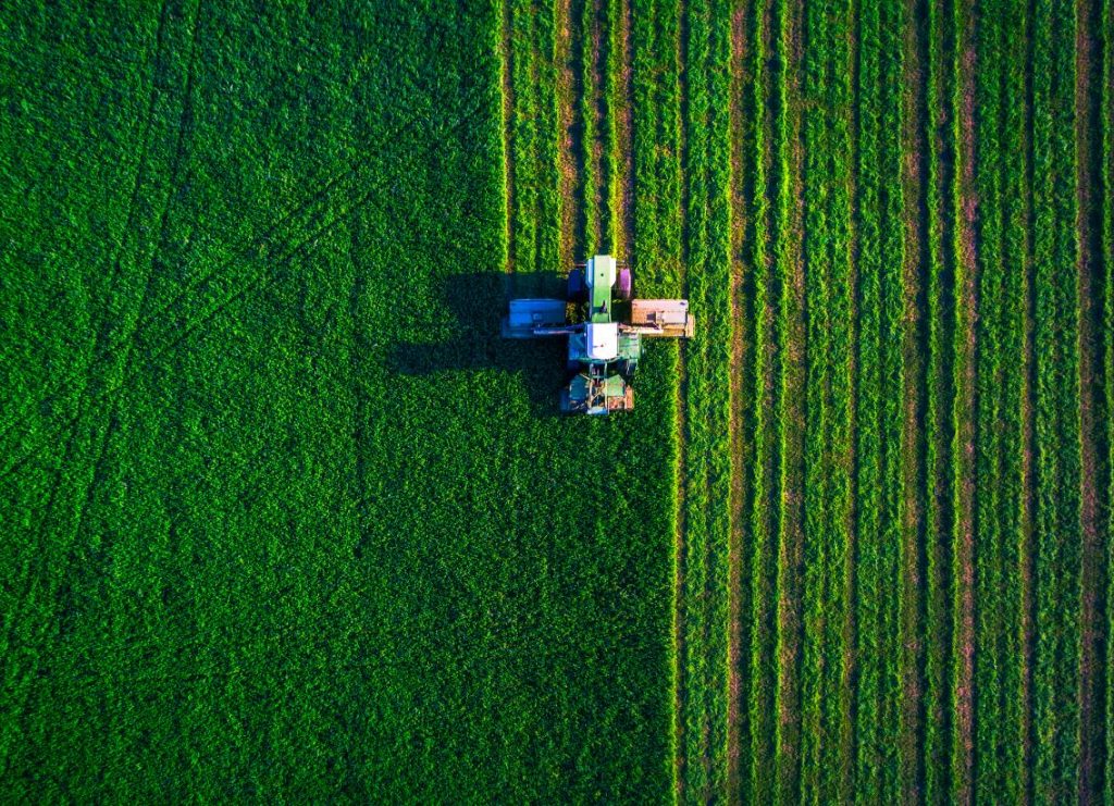 Aerial photo of a tractor ploughing a field
